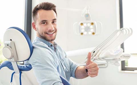 man giving a thumbs up after getting dental crowns in Corte Madera