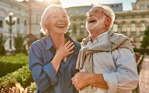 Laughing couple with dental implants in Corte Madera