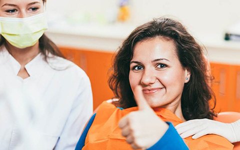 Woman smiling with an emergency dentist in Corte Madera