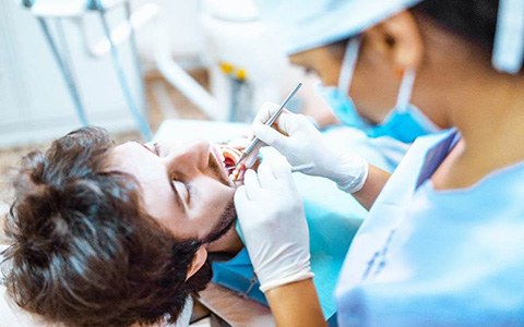 Man receiving care from emergency dentist in Corte Madera