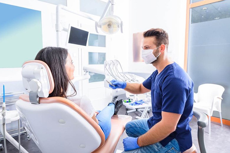 Dentist preparing to treat a patient